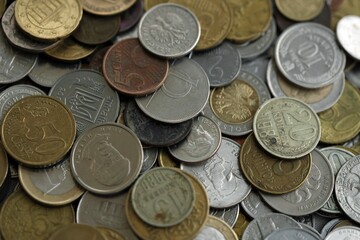Big pile of different coins from various currencies and different countries around the world. Currency exchange
