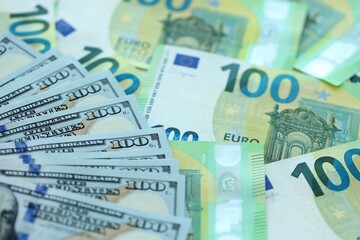 Big pile of Euro and USD banknotes. Many european and united states dollars