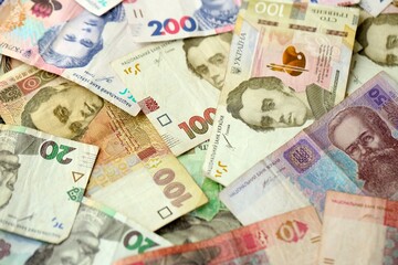 Big amount of different ukrainian hryvnia currency money bills in pile
