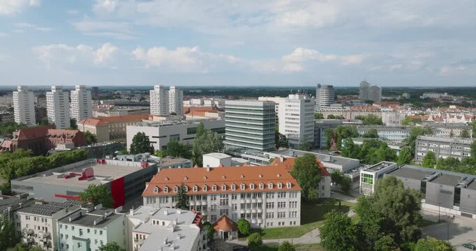 Distant aerial orbit of Plac Grunwaldzki surroundings in Wroclaw, Poland.