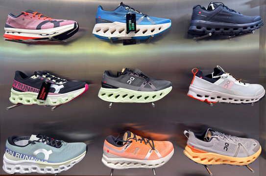 BANGKOK ,THAILAND  July 15, 2025 : On Cloud Running shoes are against the wall on display at a running shoe specialty store. On is a Swiss Company at siam paragon department store