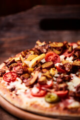 Gyros Pizza with jalapeno pepper, cherry tomatoes and mozzarella cheese. Soft focus. Close up.	