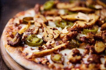 Gyros Pizza with jalapeno pepper and mozzarella cheese. Soft focus. Close up.	