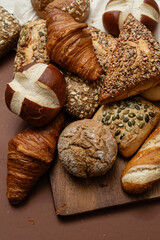 Various types of crusty German breads and flaky pastries