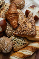 Various types of crusty German breads and flaky pastries
