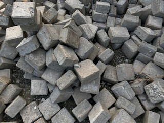 Pile of left over pavers, flooring or concrete block paving, cube shape