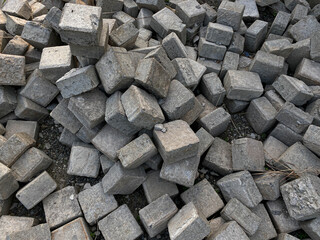 Pile of left over pavers, flooring or concrete block paving, cube shape