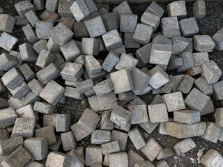 Pile of left over pavers, flooring or concrete block paving, cube shape