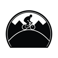 Mountain Biker Silhouette Riding on a Trail with Mountains in the Background in a Circular Frame