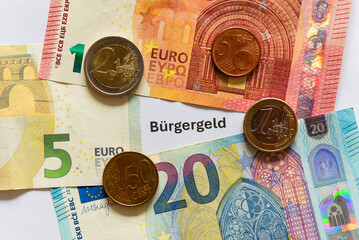 Euro Banknotes and Coins with "B&uuml;rgergeld" Text