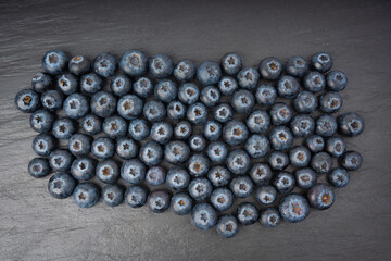 Blueberry texture background. Fresh blue berry fruits pattern, bilberry wallpaper with copy space