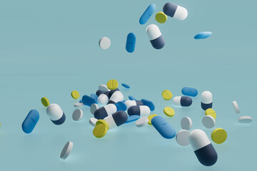 A bunch of pills are scattered on a blue background