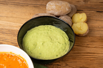 Red mojo rojo and green mojo verde sauces, traditional Tenerife dips, mojo picon dressing