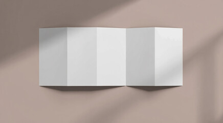 Blank accordion fold brochure or map on a textured surface with shadows