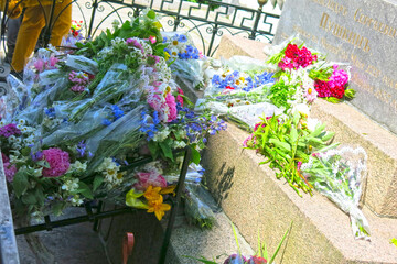 bouquets of flowers on the grave of poet A.S. Pushkin