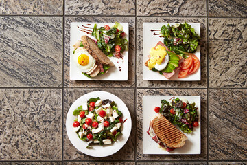 A variety of brunch foods, salads, and sandwiches
