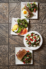 A variety of brunch foods, salads, and sandwiches
