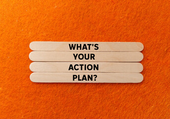 What's your action plan message written on wooden sticks on orange background. Conceptual what's your action plan symbol. Copy space.