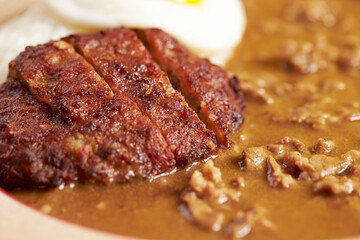 Pork cutlet with delicious Curry sauce on a plate  