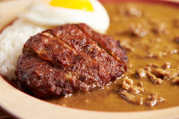 Pork cutlet with delicious Curry sauce on a plate  