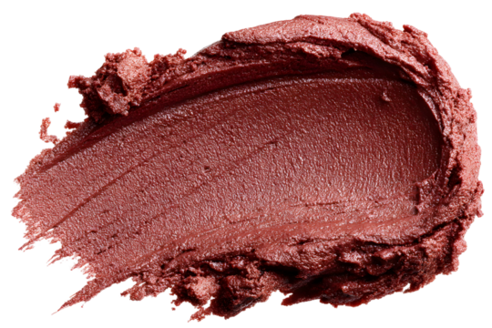 Macro close-up shot of a bronze color lipstick smudge on a black background