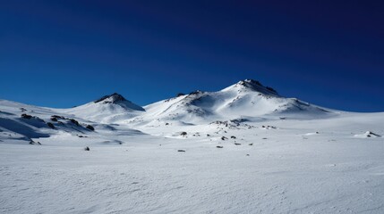 Snowy Mountain Peaks Under a Clear Blue Sky