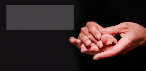 Hands making tuna sushi