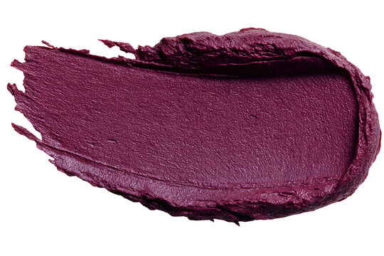 Rich plum lipstick smear on black backdrop creating an eye-catching contrast