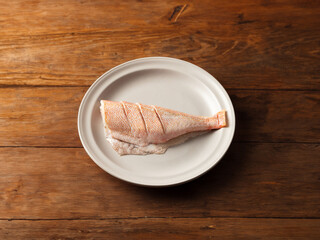 trimmed red rockfish on a plate