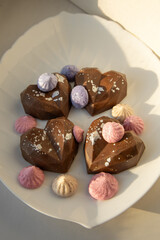 Elegant heart chocolates in sunlight