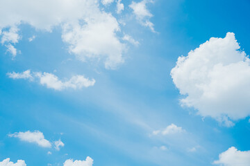 Bright Blue Sky with Fluffy White Clouds on a Sunny Day
