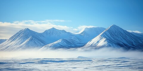 Alaska mountains under a cold north wind with snow sweeping ridges