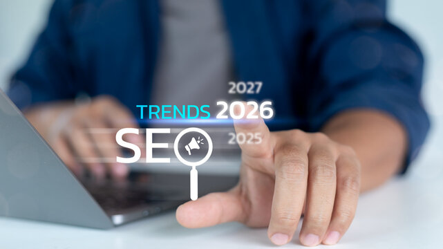 Close-up hand pointing to SEO Trends 2026 text with digital years timeline. Concept of future search engine optimization, marketing forecast, and online strategy.