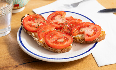 delicious bruschetta with fresh tomatoes on ciabatta slices on a plate