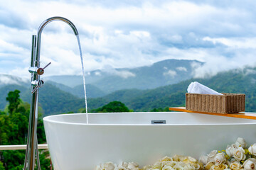 Outdoor bathtub with mountain view - a perfect escape to unwind, reconnect with nature, and enjoy luxurious serenity in the heart of the forest.
