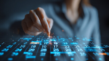 Business scheduling concept with a businesswoman marking dates on a digital calendar interface to manage workflows and important deadlines