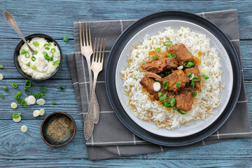 beef slow cooked with gravy served over rice