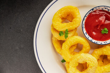 Colmar rings fried food fries fast food crispy appetizer fresh delicious gourmet food background on...