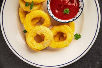 Colmar rings fried food fries fast food crispy appetizer fresh delicious gourmet food background on...