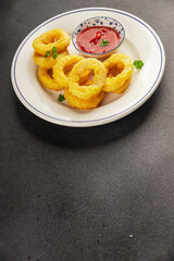 Colmar rings fried food fries fast food crispy appetizer fresh delicious gourmet food background on the table rustic food top view copy space