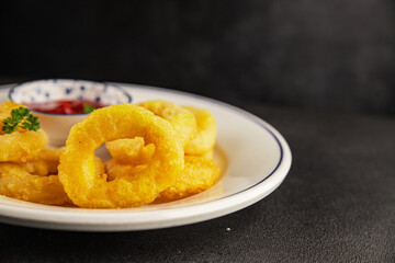 Colmar rings fried food fries fast food crispy appetizer fresh delicious gourmet food background on...