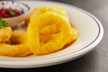Colmar rings fried food fries fast food crispy appetizer fresh delicious gourmet food background on the table rustic food top view copy space