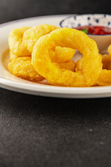 Colmar rings fried food fries fast food crispy appetizer fresh delicious gourmet food background on the table rustic food top view copy space