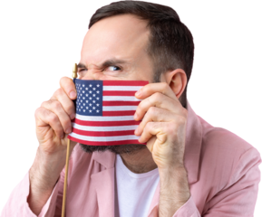 Portrait of a satisfied young man with a beard with an American flag on a red studio background. Great US patriot and defender of freedom.