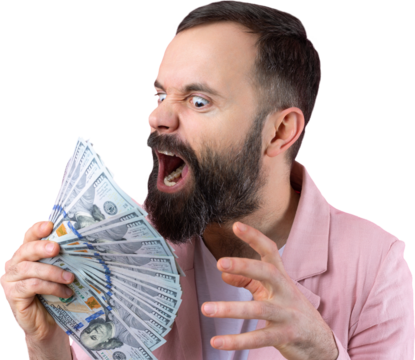Portrait of a contented young businessman with a beard dressed in a pink jacket showing us dollar banknotes against a red studio background. Taste, smell of money.