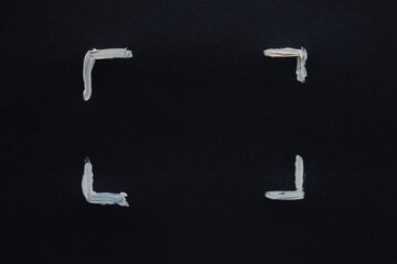 White painted corner frame on black paper as a focus mark, scan, graphic design, photo
