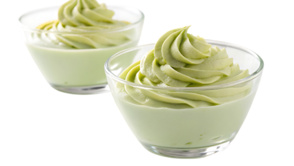 Two glass bowls with green dessert on white base