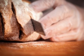 The Moment of Slicing Bread with a Knife