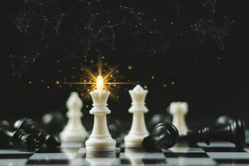 Leadership. gold queen with silver chess pieces on chess board game competition on dark background,...