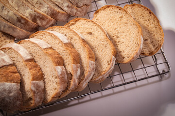 Freshly Baked Bread Slices Cooling on a Rack